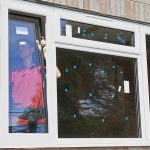 Construction Worker Installing New Windows In House